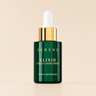 Séréne Elixir Gold & Caviar Serum bottle with dropper on a beige background